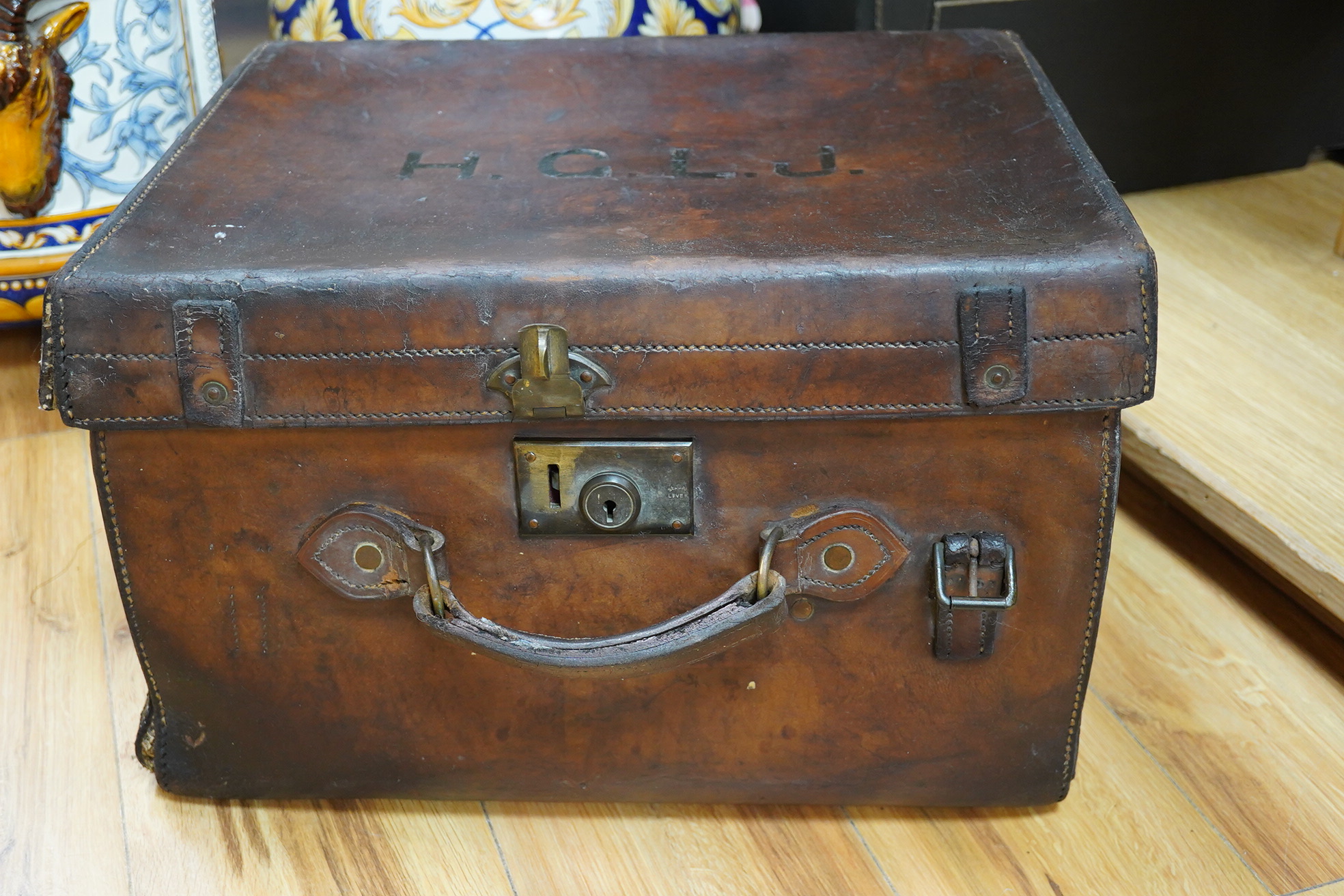 An early 20th century brown leather trunk